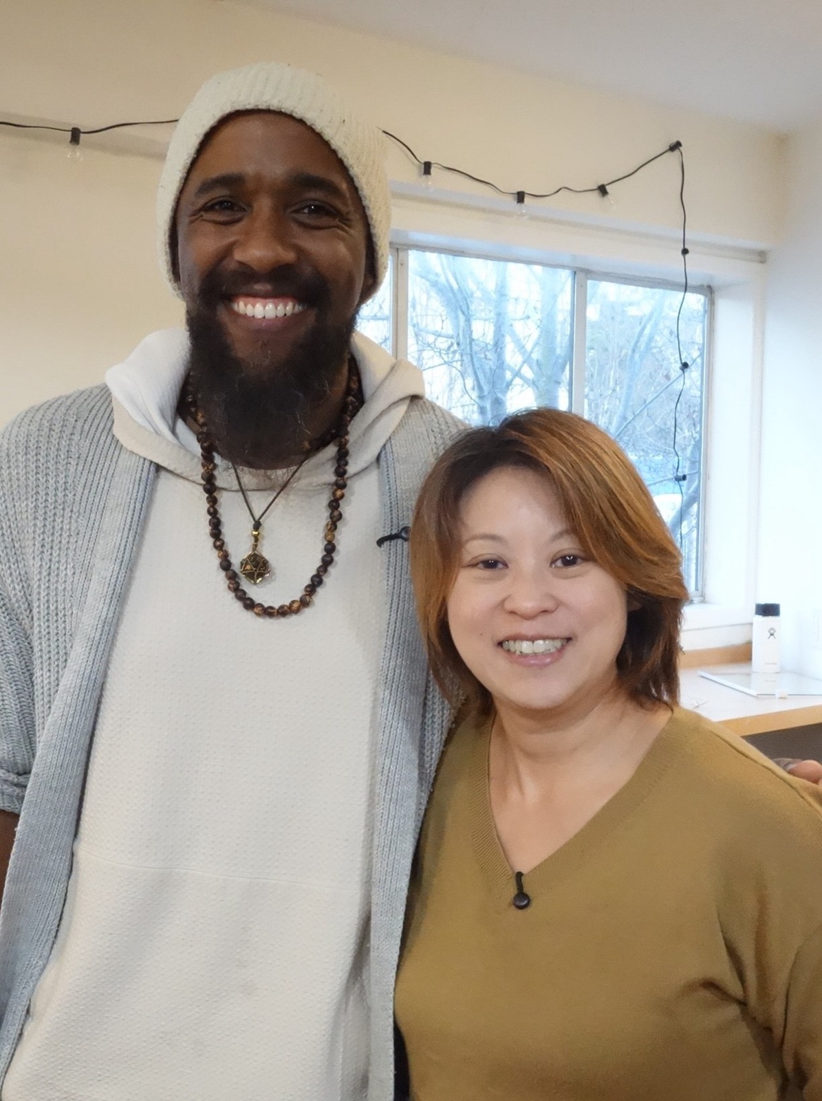 A smiling patient with Dr. Deborah Ma at Puzzle Acupuncture